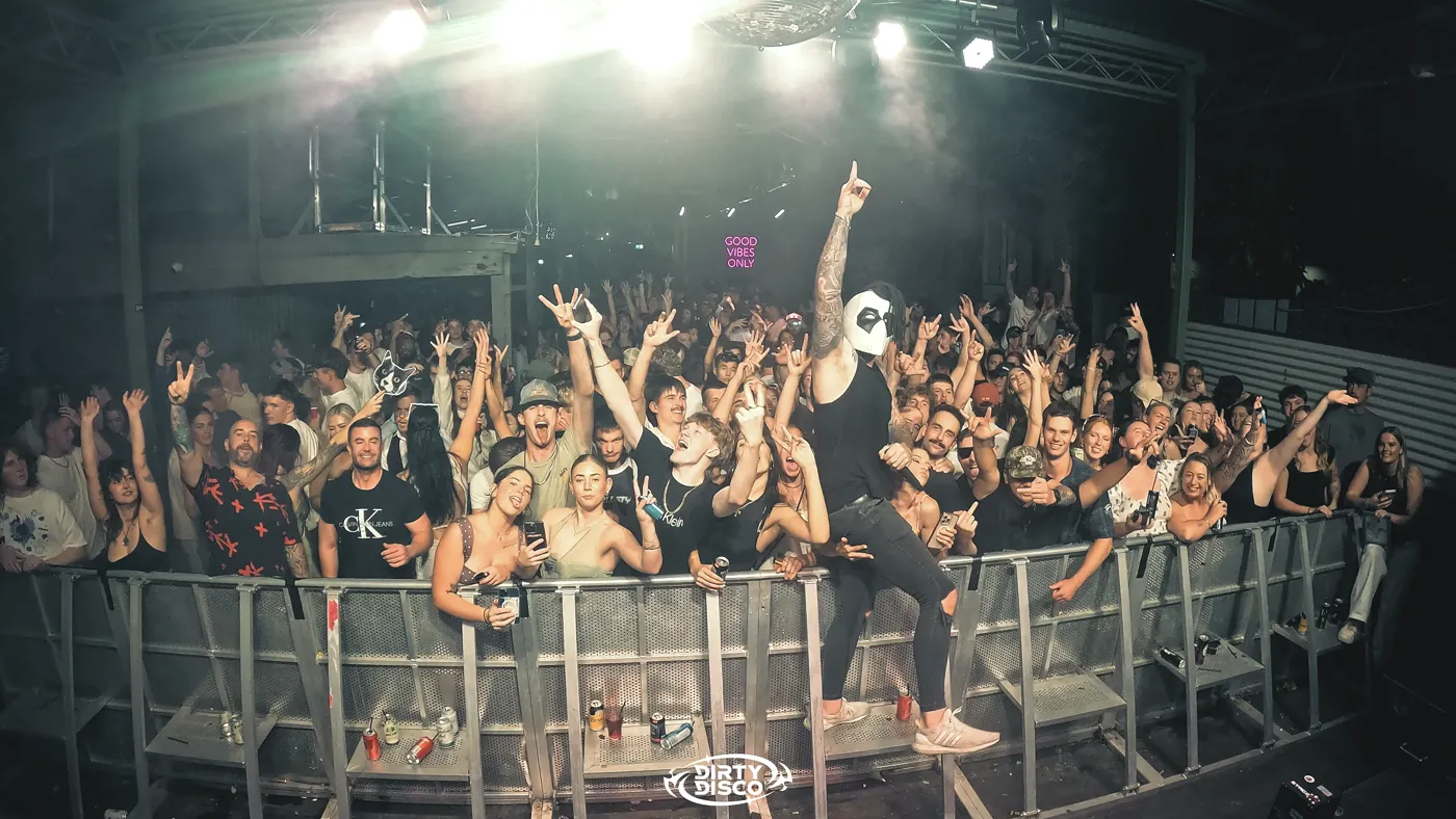 Dirty Disco crowd under red light